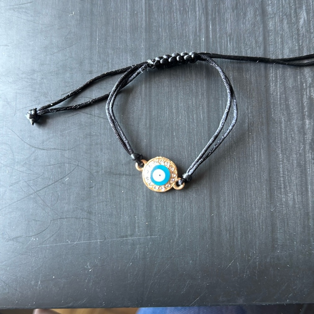 Adjustable evil eye string bracelet- never worn!